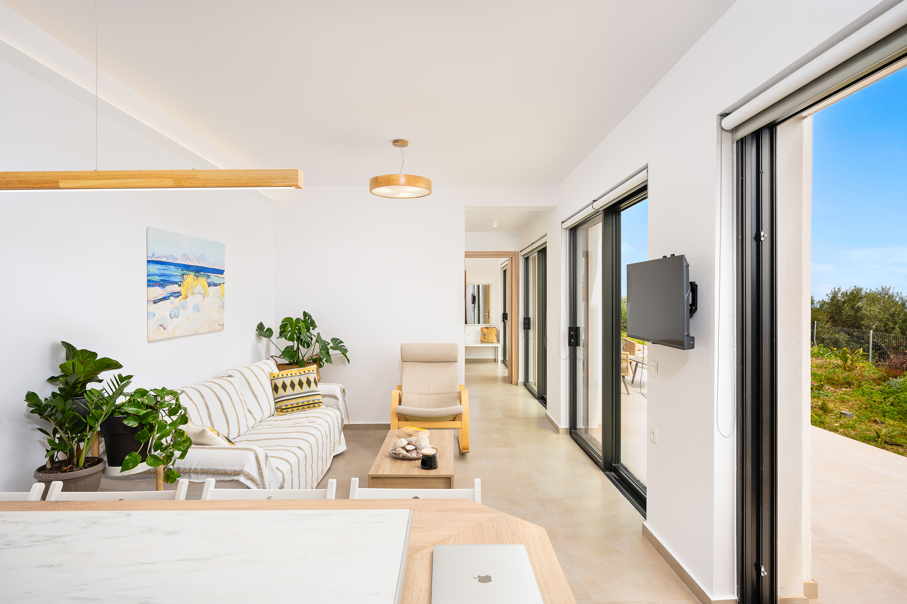 Living room with large windows and sea outlook